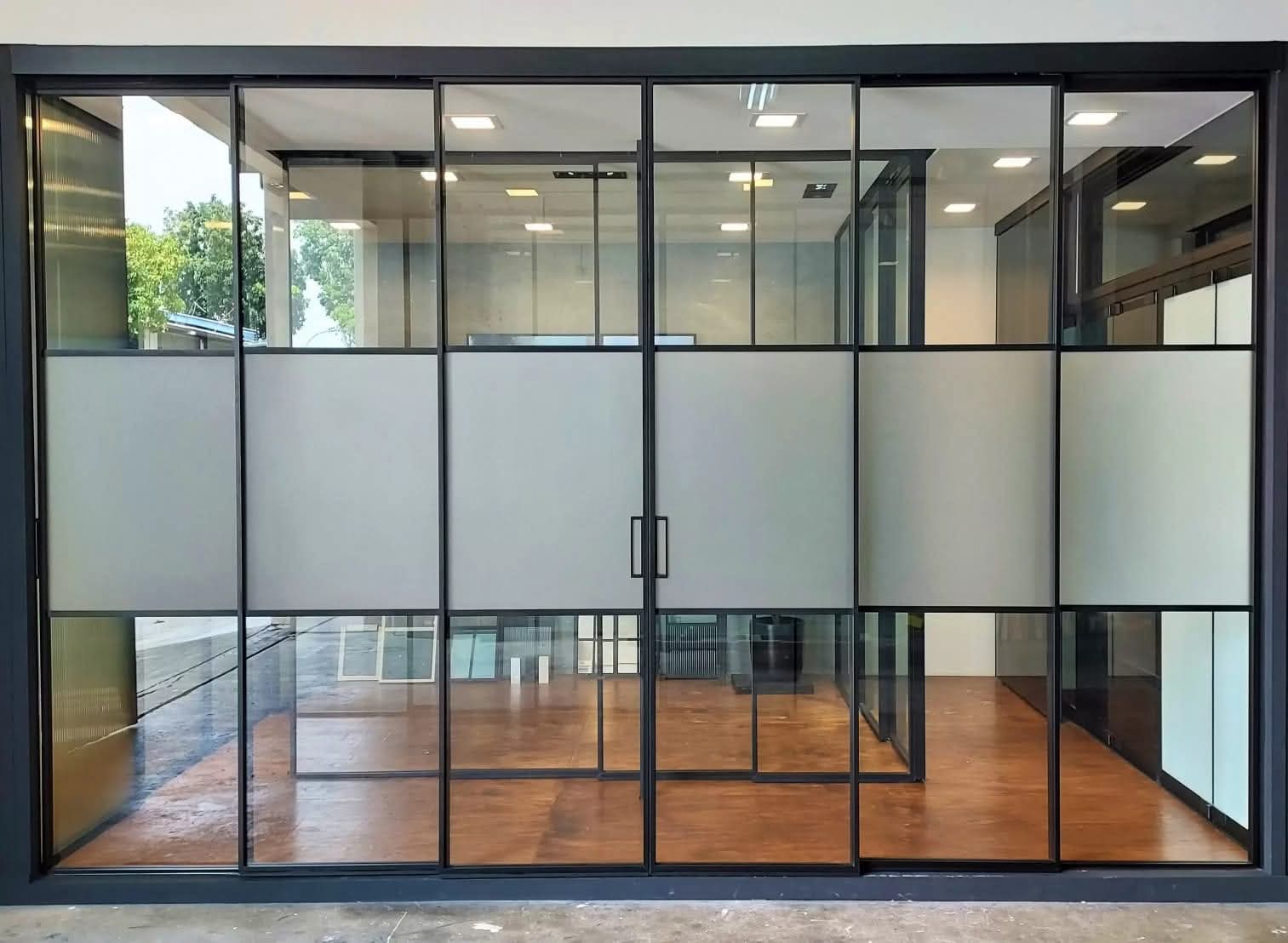 Black aluminium framed glass partition