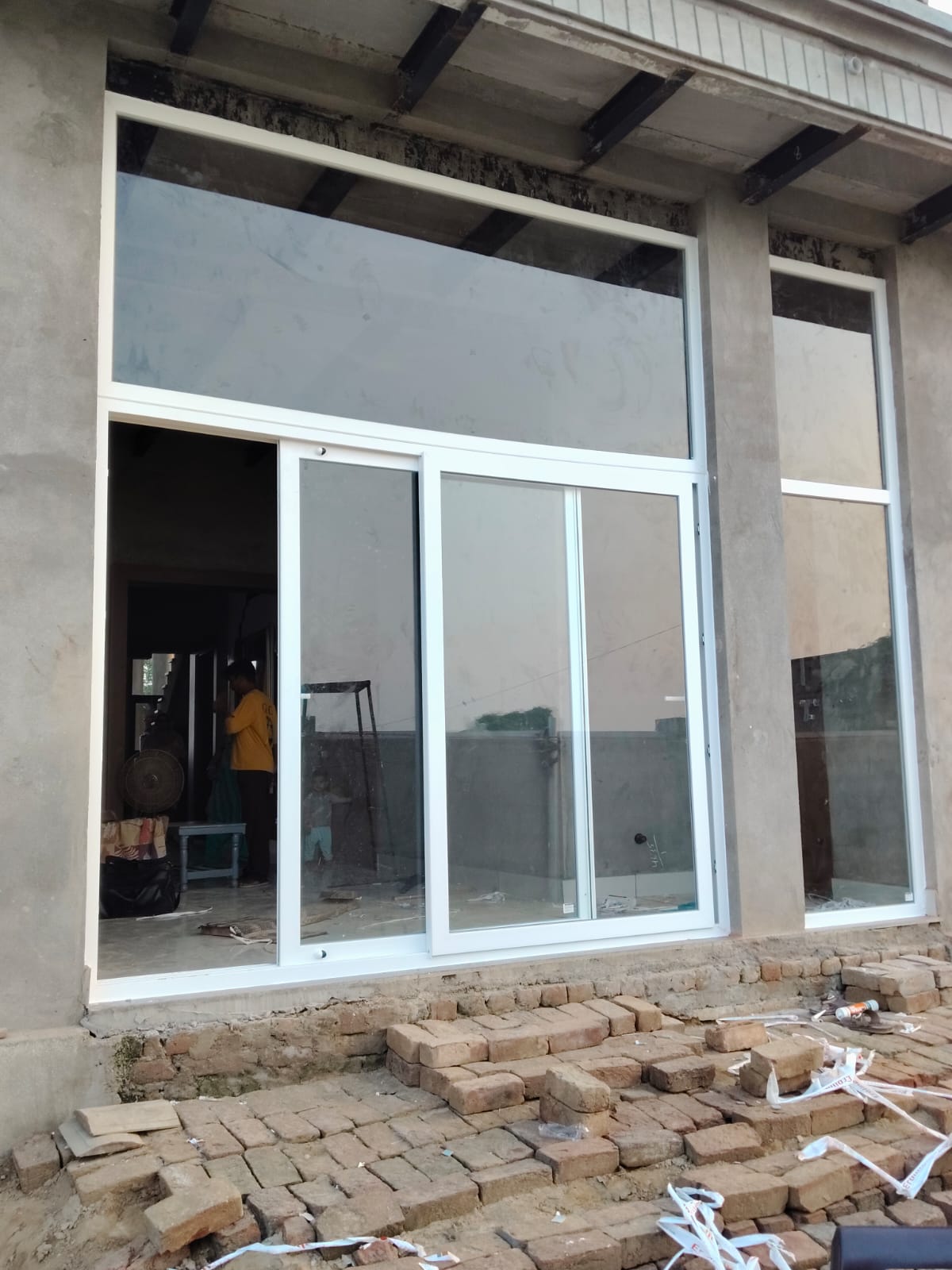 White uPVC sliding door and window installation